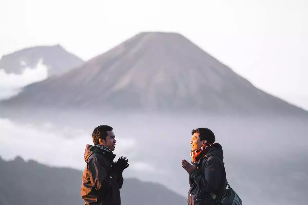 Friends talking in the mountains