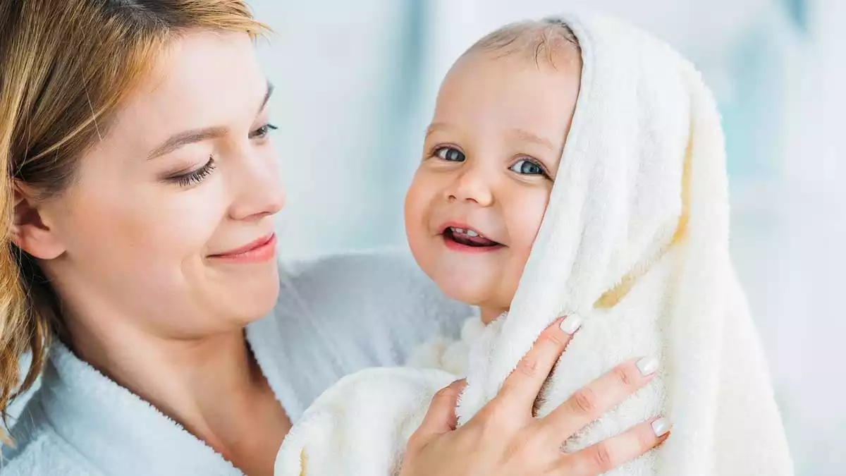 Mother smiling at her baby.