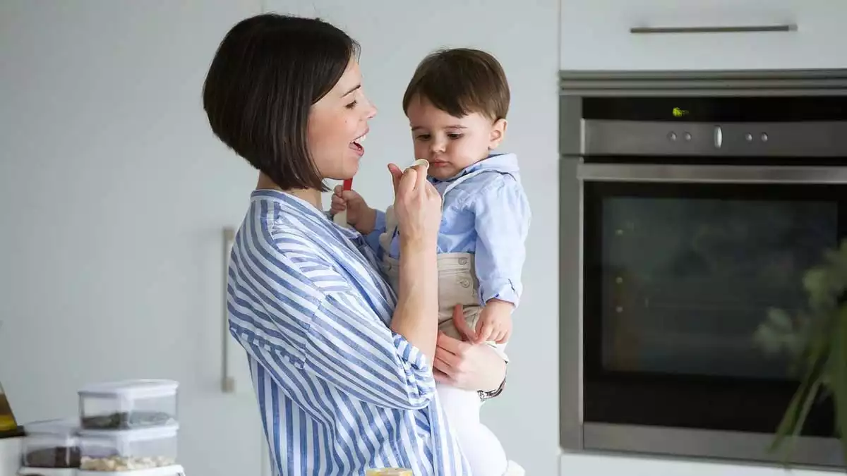 Mother feeding his son