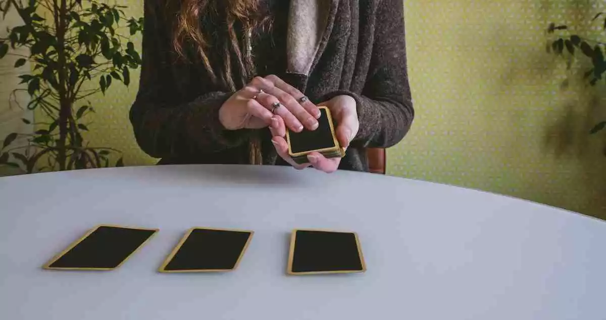 A woman spreading out some cards