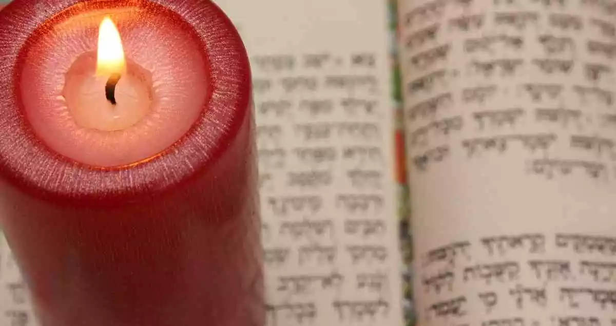 hebrew book and a candle