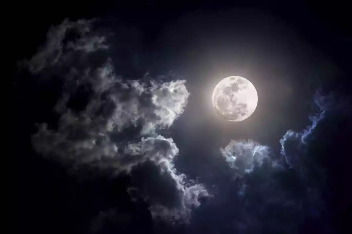 Bright full moon with clouds