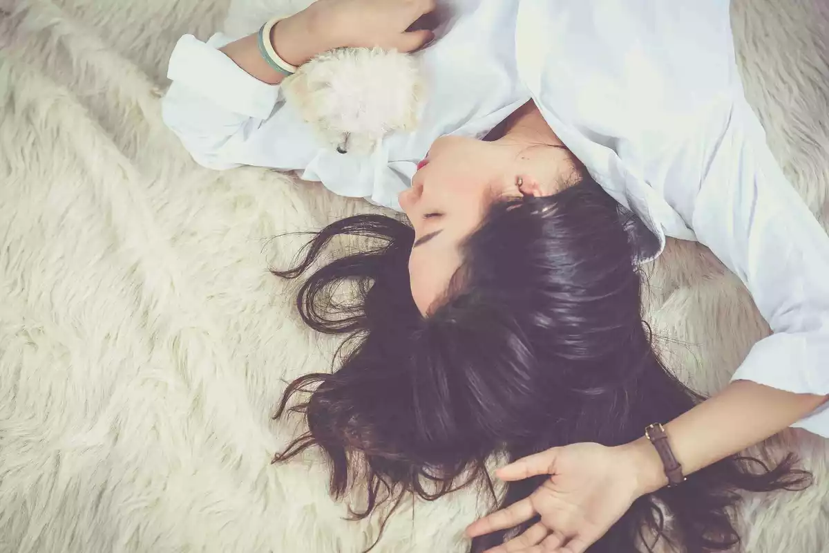 Overhead shot of a girl sleeping on a bed