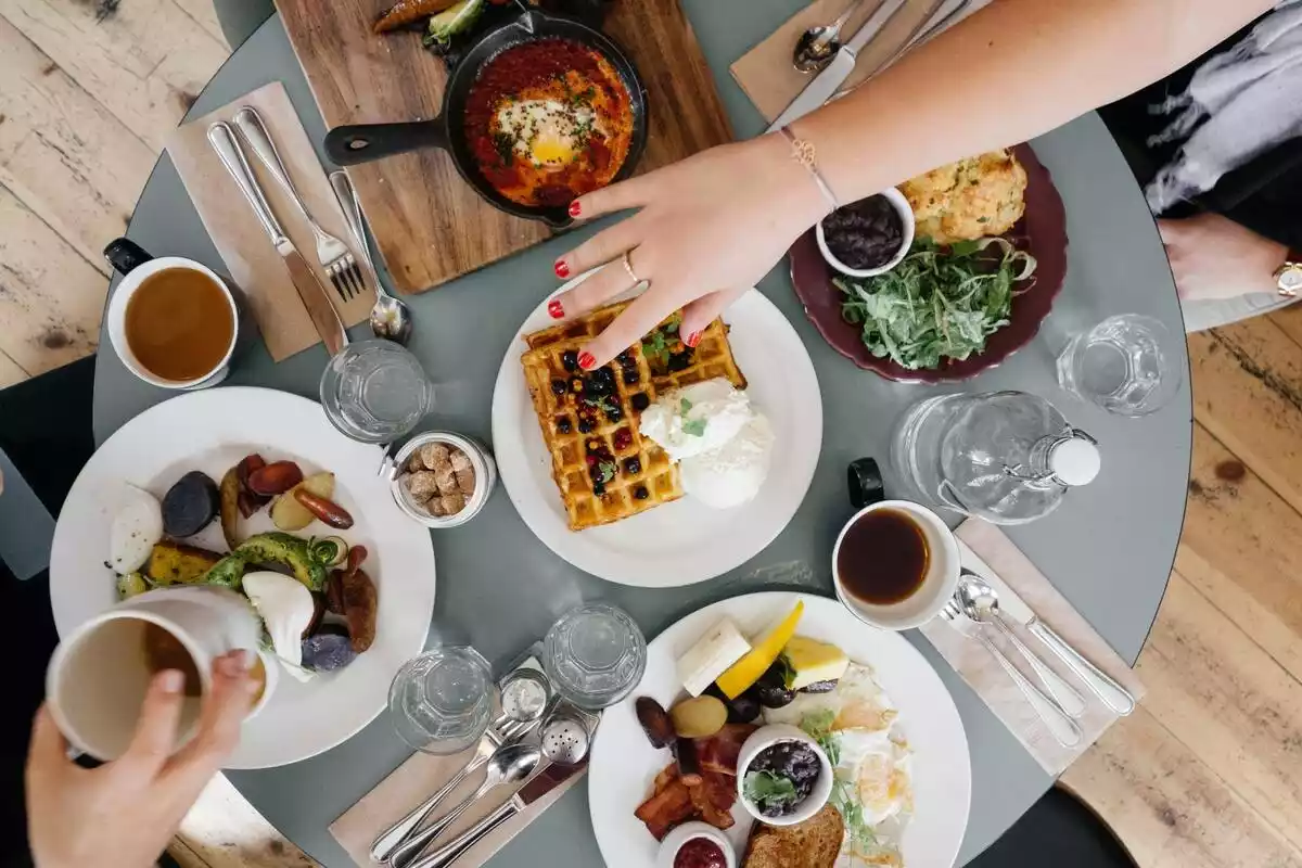 Table with a multitude of dishes and a variety of food