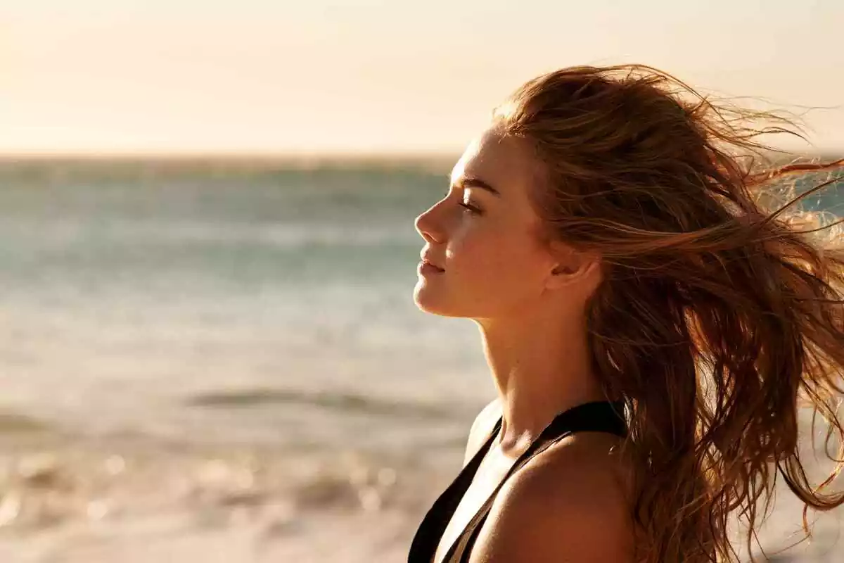 Woman next to the ocean